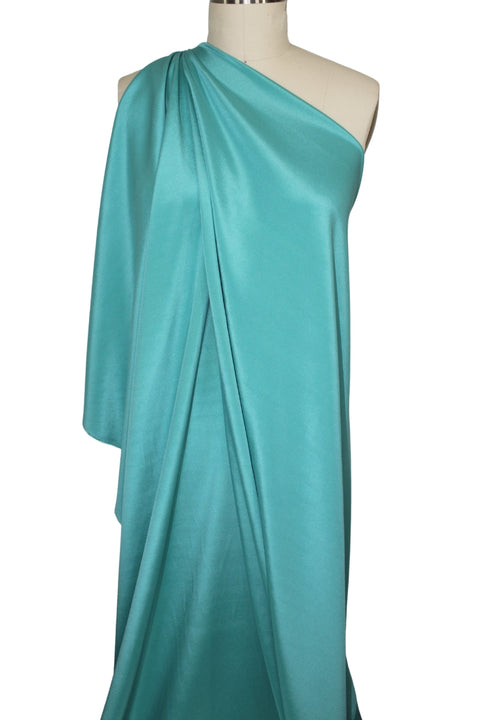 4 ply stretch silk crepe on full length mannequin teal turquoise