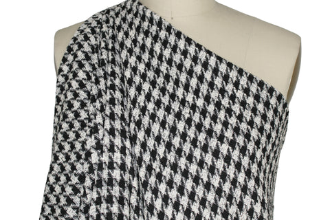 Black and white houndstooth bouclé tweed
