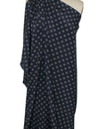Silk crepe de chine in navy with grommet-shaped print