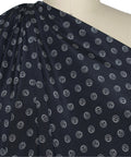 Silk crepe de chine in navy with grommet-shaped print