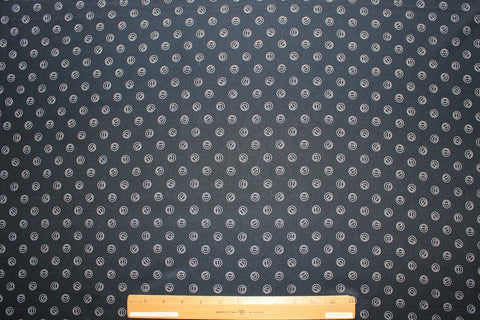 Silk crepe de chine in navy with grommet-shaped print