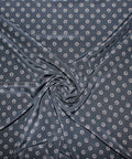 Silk crepe de chine in navy with grommet-shaped print