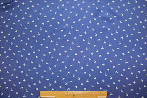0scar silk crepe de chine in a dainty floral pattern on blue background