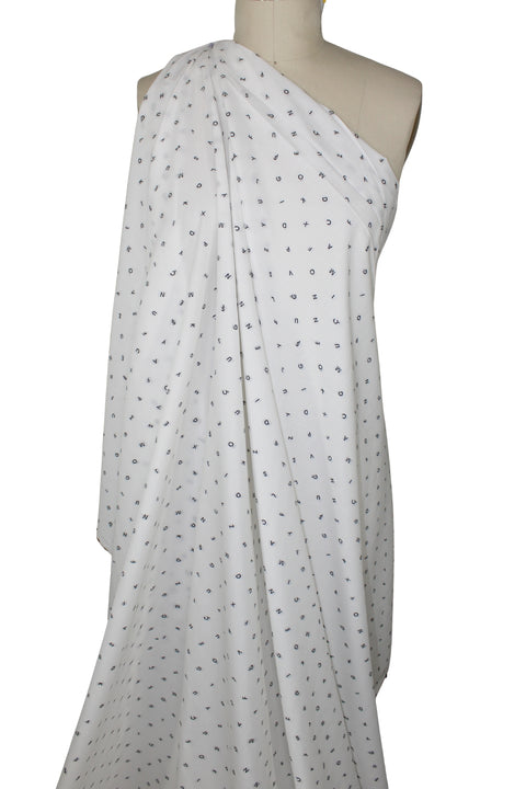 Italian cotton shirting with letters woven into it
