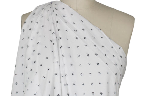 Italian cotton shirting with letters woven into it