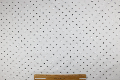 Italian cotton shirting with letters woven into it