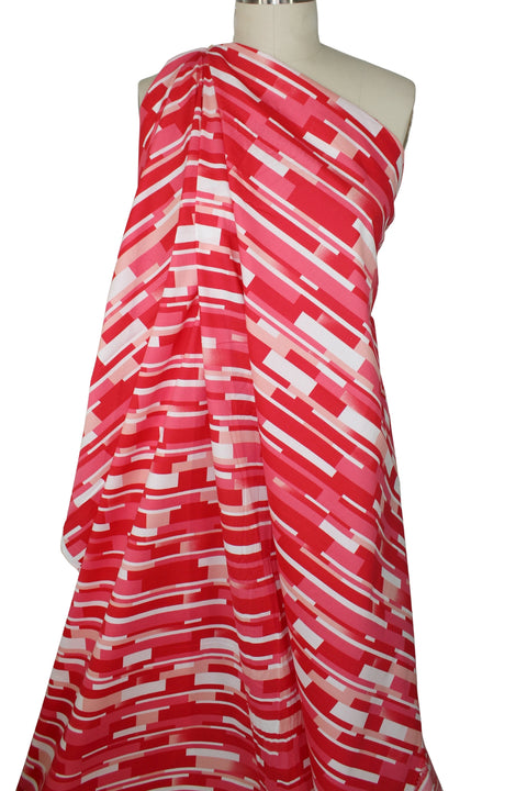 "Tile" print cotton in red tones