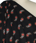 Red paisley on black background cotton