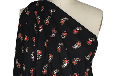 Red paisley on black background cotton