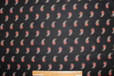 Red paisley on black background cotton