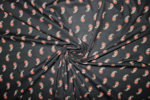 Red paisley on black background cotton