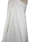Distressed white denim fabric