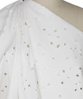 Distressed white denim fabric
