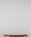 Distressed white denim fabric