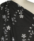 Floral vines eyelet on dark brown cotton fabric