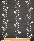 Floral vines eyelet on dark brown cotton fabric