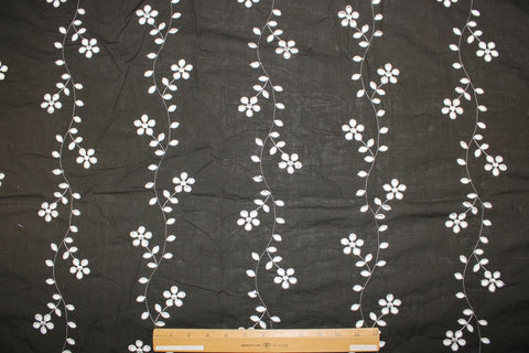 Floral vines eyelet on dark brown cotton fabric