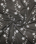 Floral vines eyelet on dark brown cotton fabric