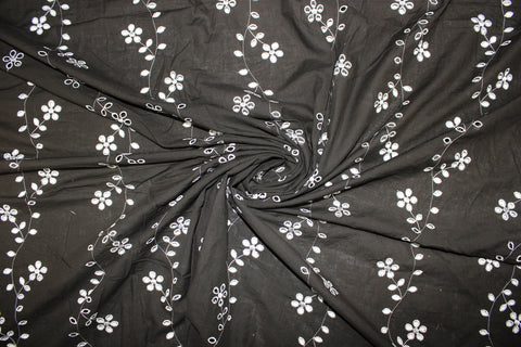 Floral vines eyelet on dark brown cotton fabric