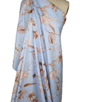 Leaf print linen in browns on blue