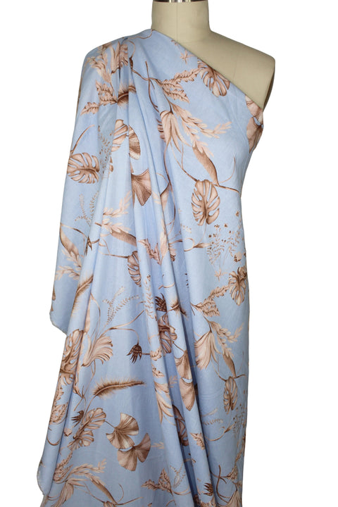 Leaf print linen in browns on blue