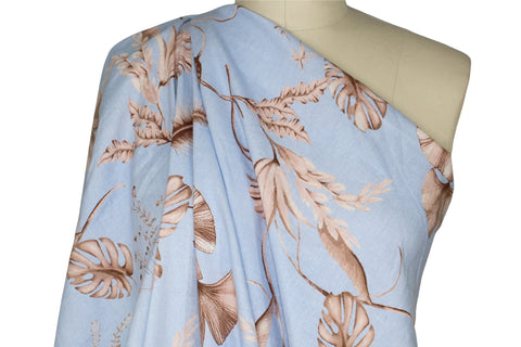 Leaf print linen in browns on blue