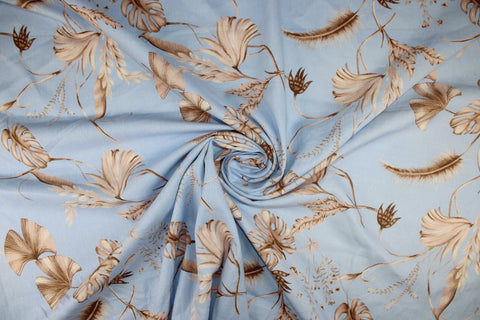 Leaf print linen in browns on blue
