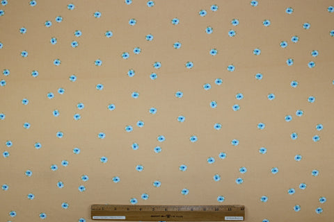 ITY jersey with blue flowers on a creamsicle ground. 