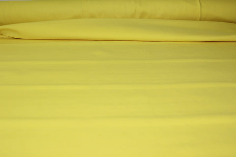 Bright yellow rayon double knit fabric