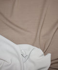 viscose double knit fabric, white side on lower left, tan side on upper right