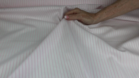 Pinstriped cotton shirting in pink on white