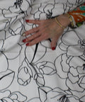 Black and white pen and ink style floral cotton sateen
