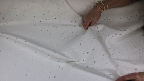 Distressed white denim fabric