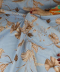 Leaf print linen in browns on blue