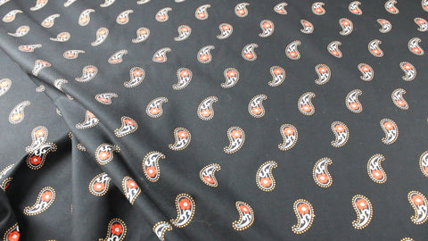 Red paisley on black background cotton