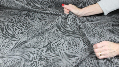 Double faced scuba knit fabric with animal print