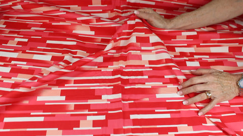 "Tile" print cotton in red tones