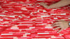 "Tile" print cotton in red tones